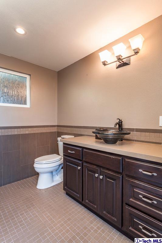 2017 Midwick Drive Altadena, CA 91001 - Photo 32 of 61 a bathroom with a toilet a sink and mirror