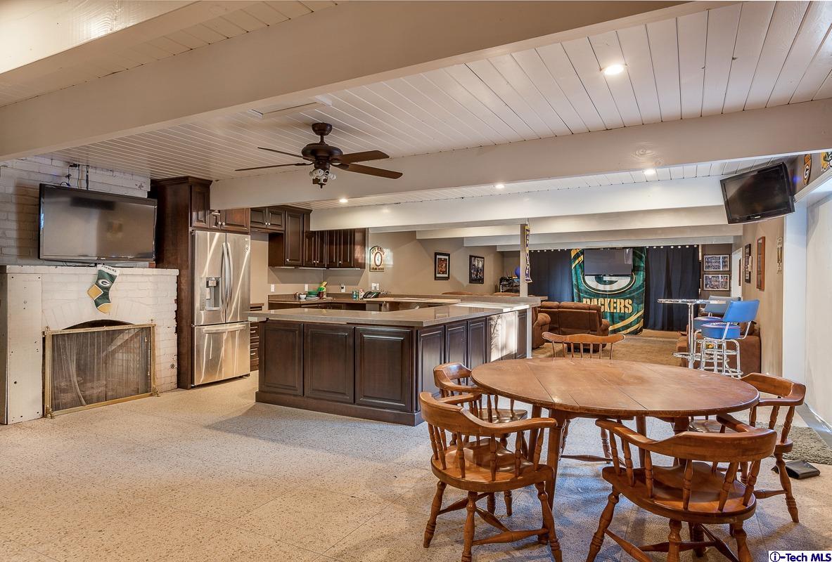 2017 Midwick Drive Altadena, CA 91001 - Photo 40 of 61 a kitchen with a table chairs microwave and cabinets