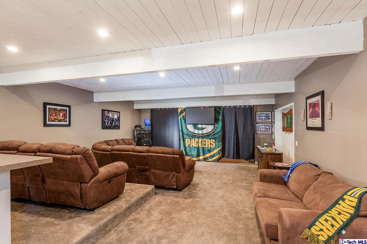 2017 Midwick Drive Altadena, CA 91001 - Photo 42 of 61 a living room with furniture a computer on the desk and a window