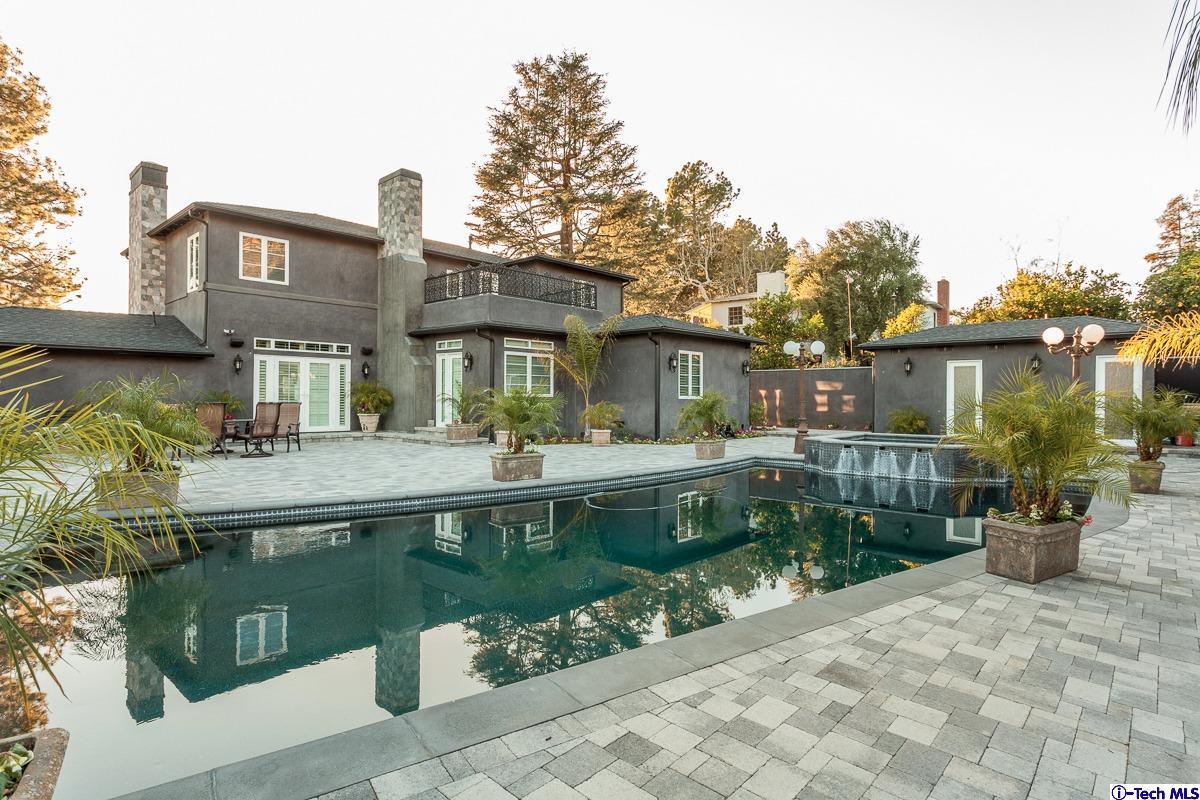 2017 Midwick Drive Altadena, CA 91001 - Photo 44 of 61 a front view of a house with a yard table and chairs