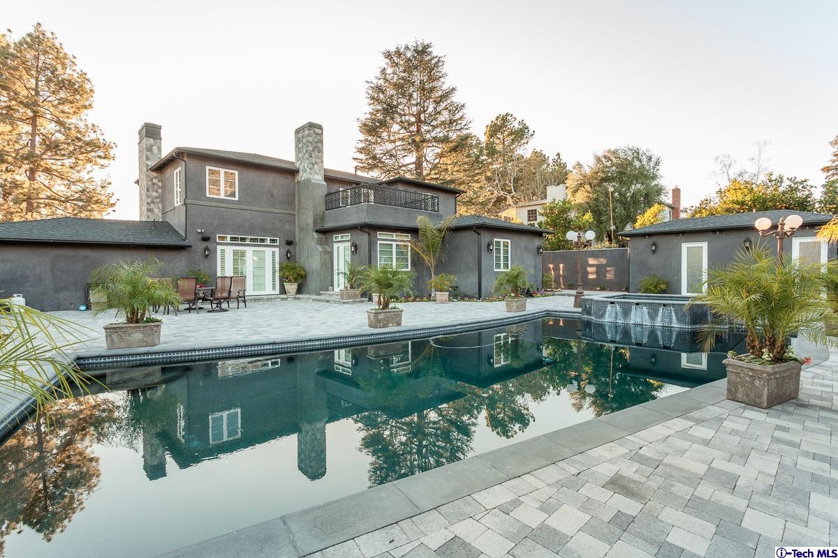 2017 Midwick Drive Altadena, CA 91001 - Photo 49 of 61 a front view of a house with a yard table and chairs