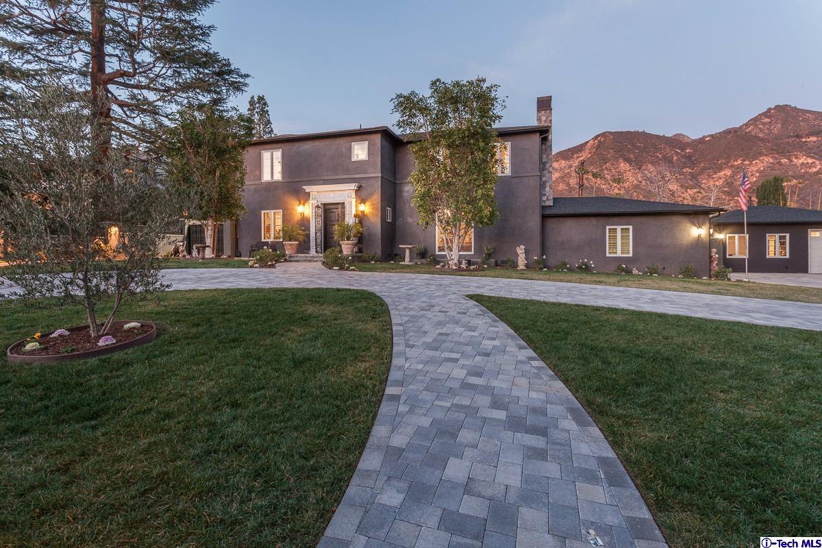 2017 Midwick Drive Altadena, CA 91001 - Photo 60 of 61 a front view of a house with a garden and yard