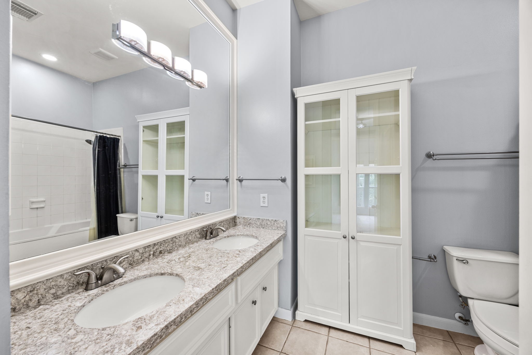 3023 Austin Street Houston, TX 77004 - Photo 19 of 26 Primary bath has granite counters and double sinks