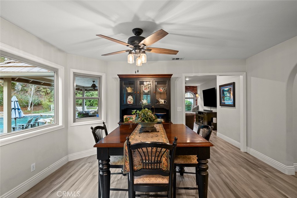1624 Alessandro Road Redlands, CA 92373 - Photo 15 of 58 a view of a dining room with furniture window and wooden floor