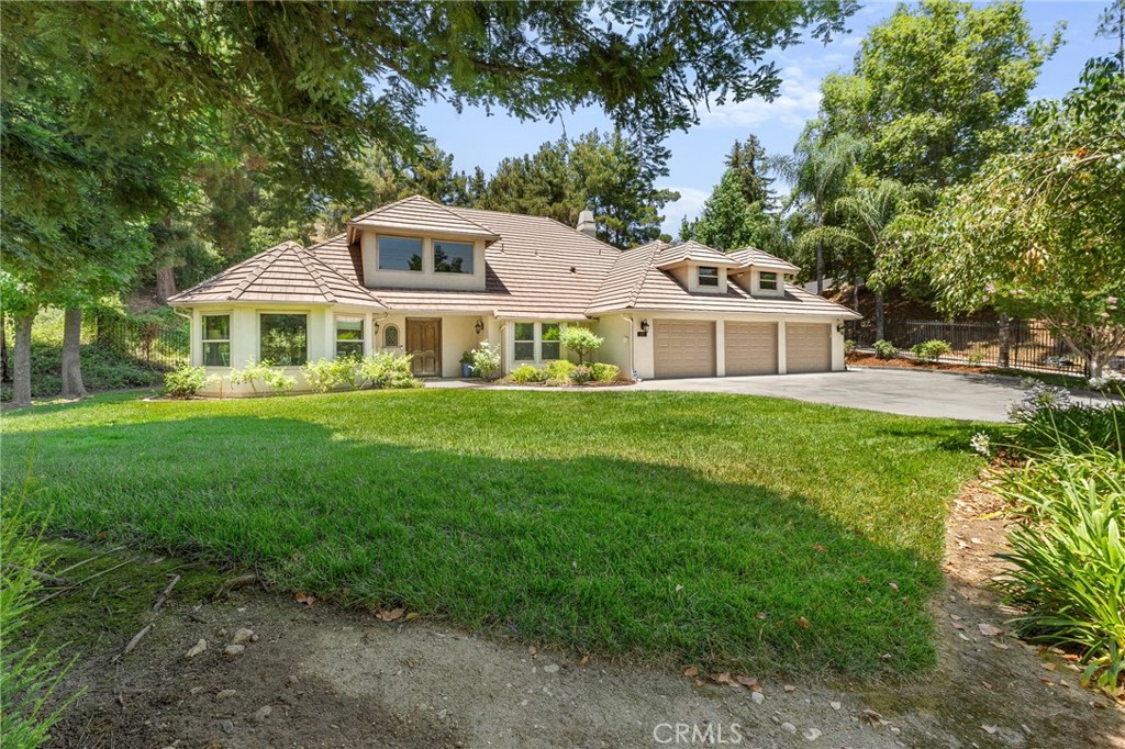 1624 Alessandro Road Redlands, CA 92373 - Photo 3 of 58 a front view of a house with a garden