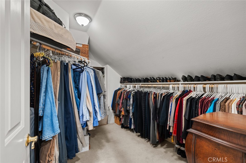 1624 Alessandro Road Redlands, CA 92373 - Photo 31 of 58 a view of walk in closet with clothes