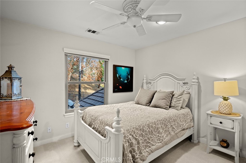 1624 Alessandro Road Redlands, CA 92373 - Photo 33 of 58 a bedroom with a bed and a window