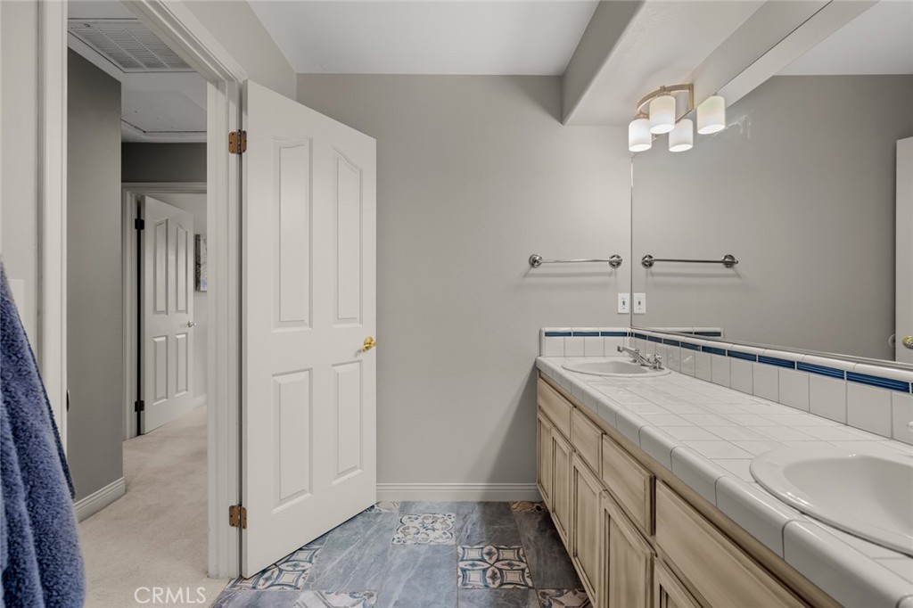 1624 Alessandro Road Redlands, CA 92373 - Photo 34 of 58 a bathroom with a sink and a mirror