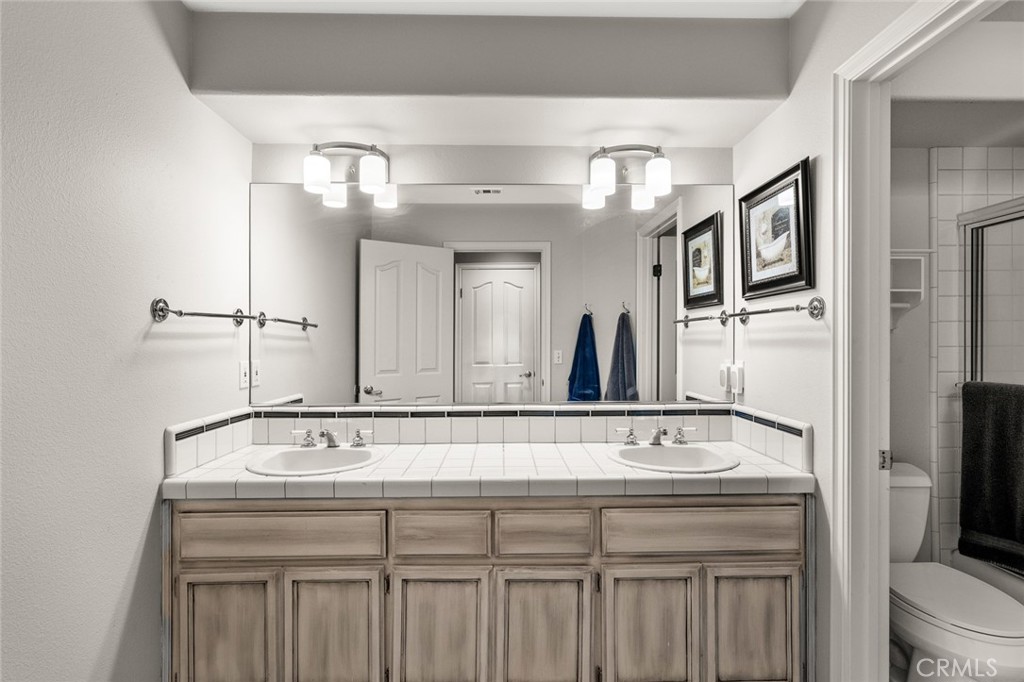 1624 Alessandro Road Redlands, CA 92373 - Photo 35 of 58 a bathroom with a sink and a mirror