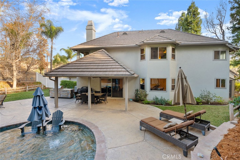 1624 Alessandro Road Redlands, CA 92373 - Photo 50 of 58 a view of a patio with a table and chairs under an umbrella