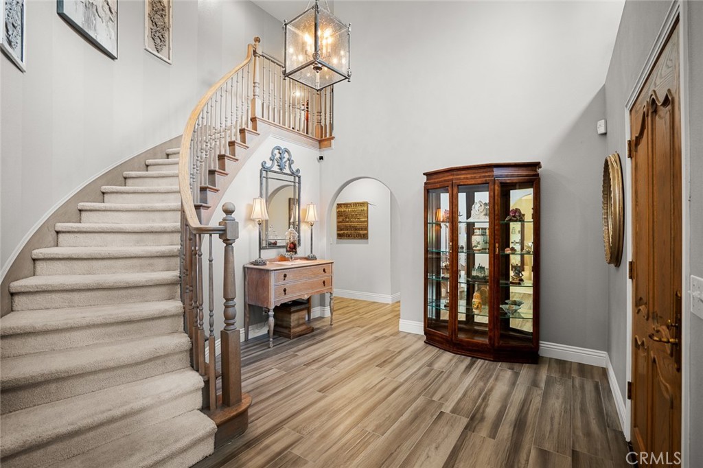 1624 Alessandro Road Redlands, CA 92373 - Photo 5 of 58 a view of front door with wooden floor and stairs