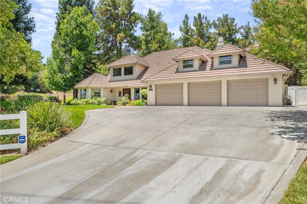 1624 Alessandro Road Redlands, CA 92373 - Photo 54 of 58 a front view of a house with a garden and plants