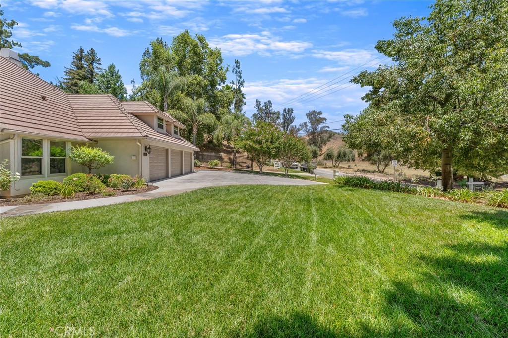 1624 Alessandro Road Redlands, CA 92373 - Photo 57 of 58 a backyard of a house with table and chairs