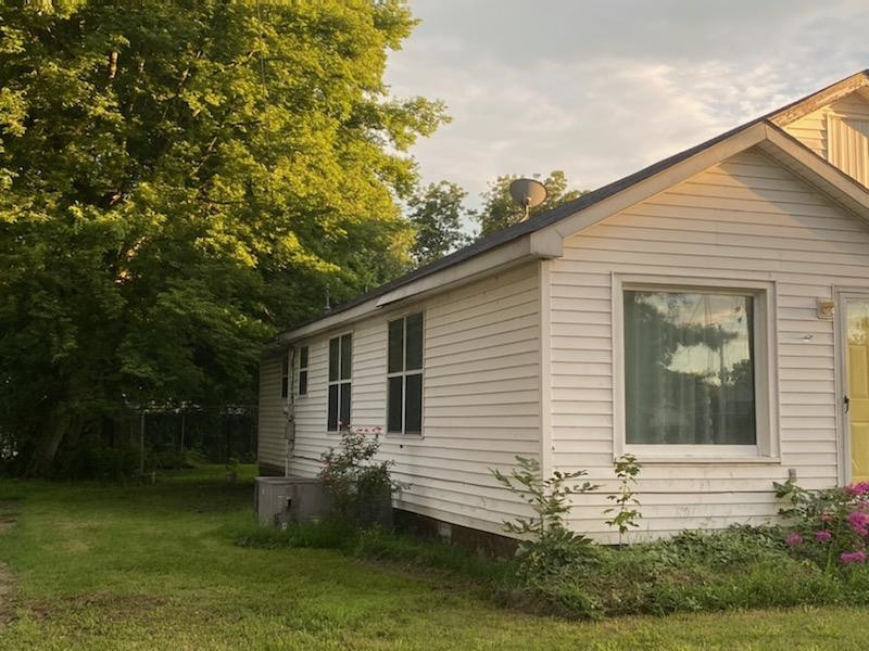 521 North Street Ridgely, TN 38080 - Photo 2 of 7 a front view of a house with garden