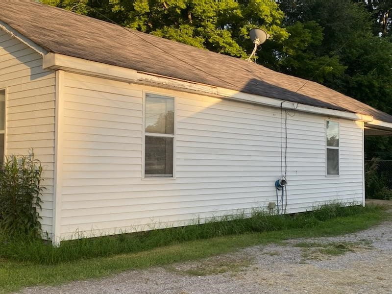 521 North Street Ridgely, TN 38080 - Photo 3 of 7 a view of a white house with a yard