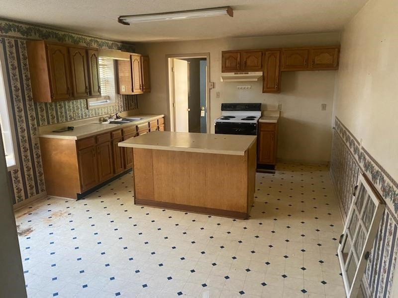 521 North Street Ridgely, TN 38080 - Photo 6 of 7 a kitchen with a cabinets and a stove top oven