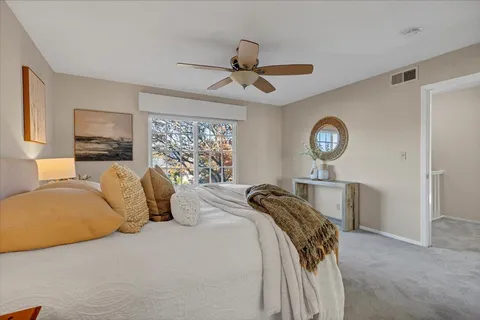 a bedroom with a bed and window