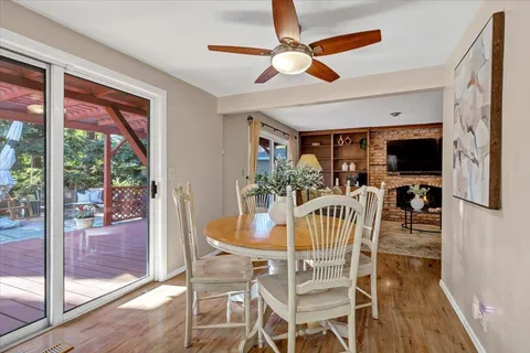 a view of a dining room with furniture window and wooden floor