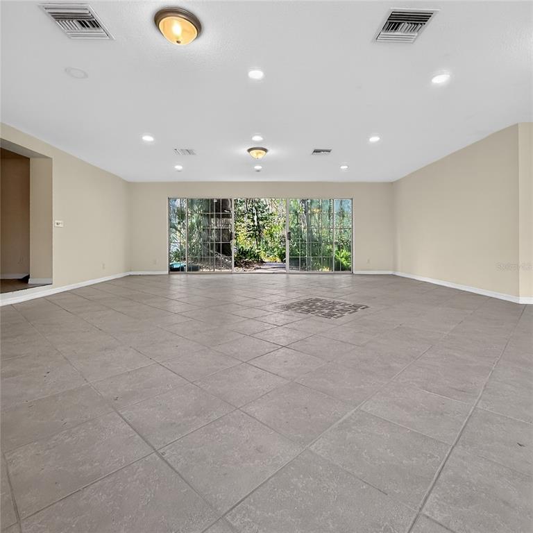 17220 Estes Road Lutz, FL 33548 - Photo 22 of 25 a view of an empty room with glass windows