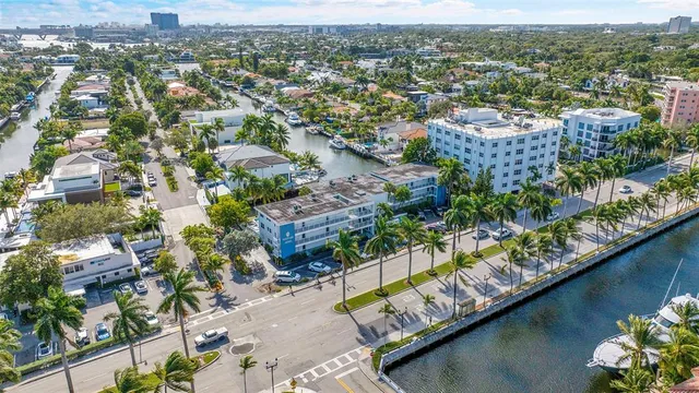 an aerial view of residential building and lake