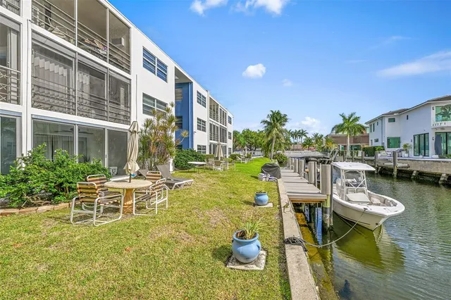 a balcony with chairs and a table