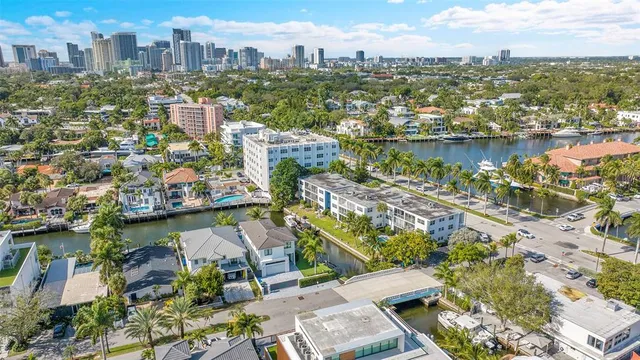 an aerial view of a city with lake view