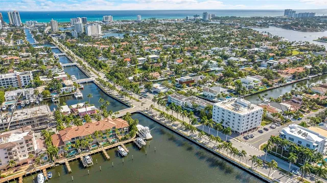 an aerial view of residential building with outdoor space and lake view