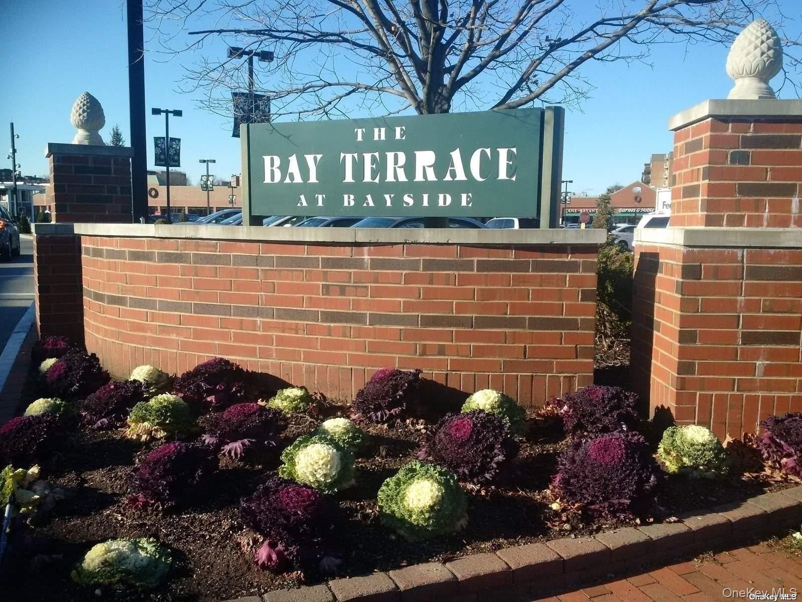 18-40 211th Street, Unit 4E Queens, NY 11360 - Photo 10 of 12 a view of a street with a bunch of flowers