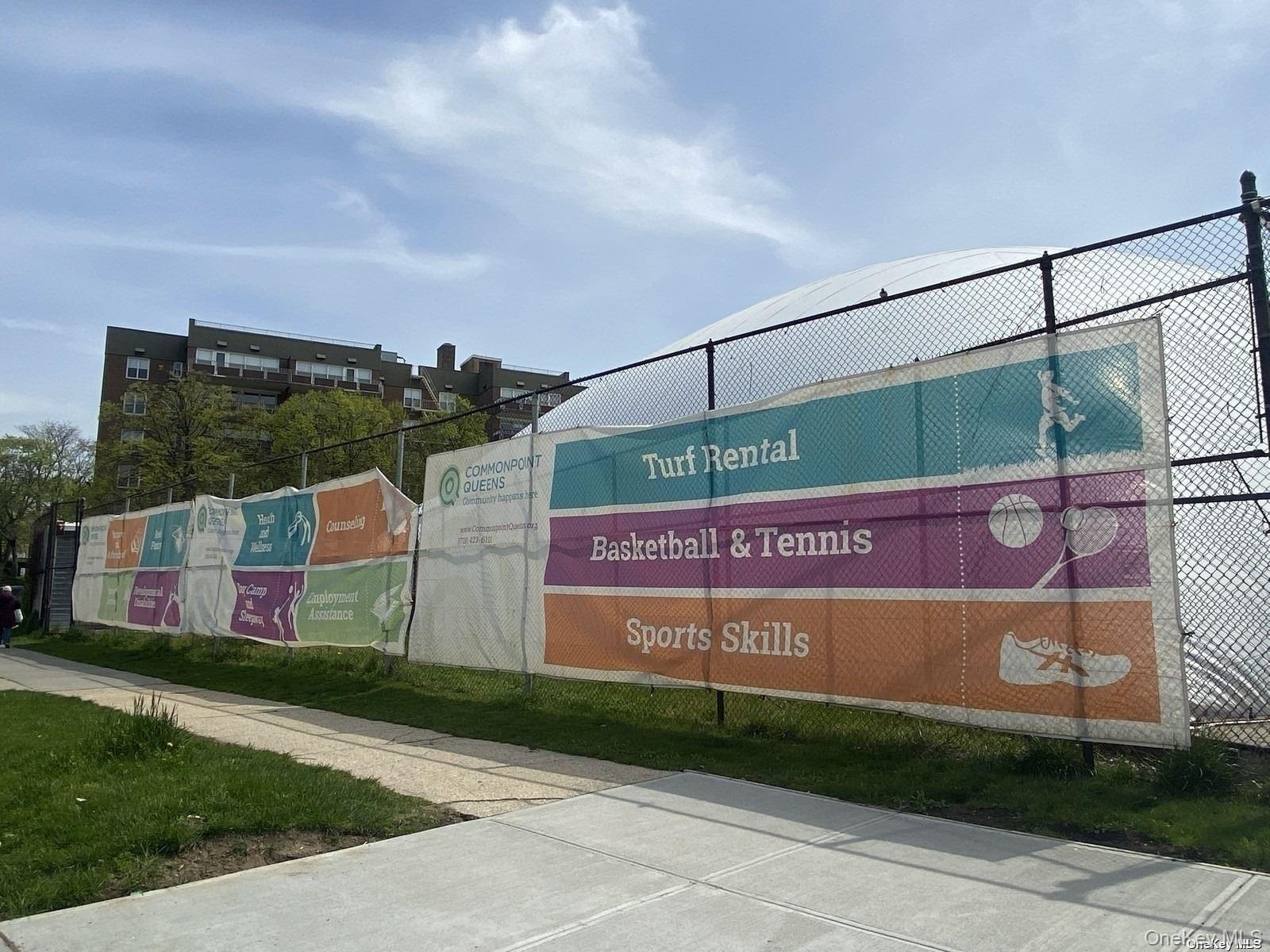 18-40 211th Street, Unit 4E Queens, NY 11360 - Photo 11 of 12 a view of a street sign