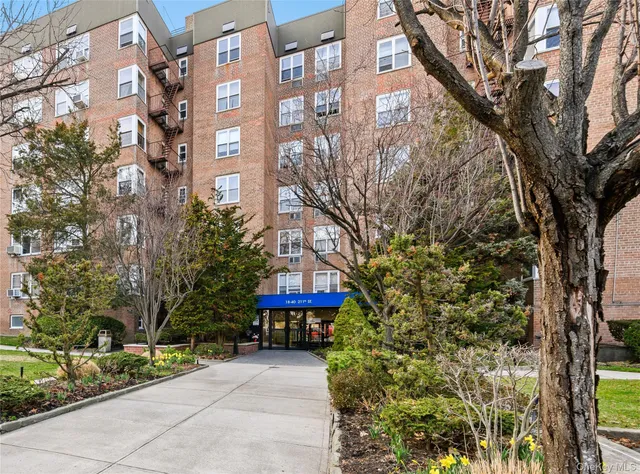a view of a building with a tree