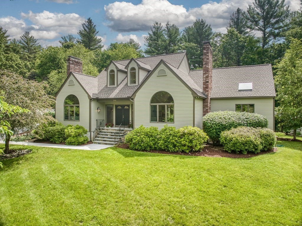 246 Elizabeth Ridge Road Carlisle, MA 01741 - Photo 1 of 38 a front view of a house with a yard