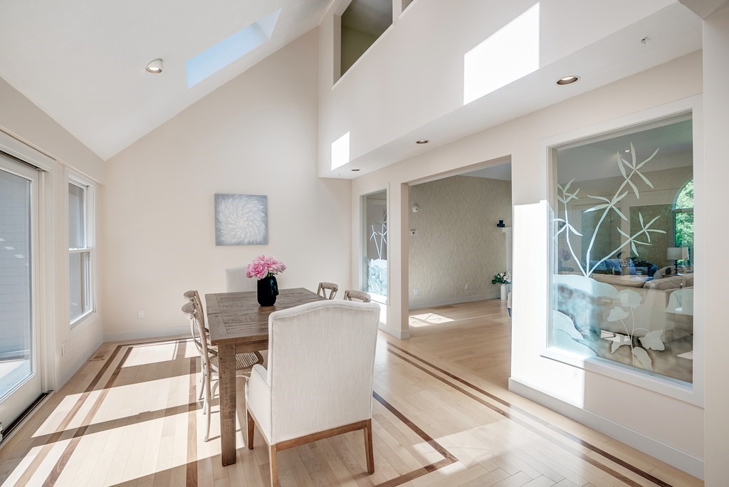 246 Elizabeth Ridge Road Carlisle, MA 01741 - Photo 22 of 38 a dining room with furniture and a floor to ceiling window