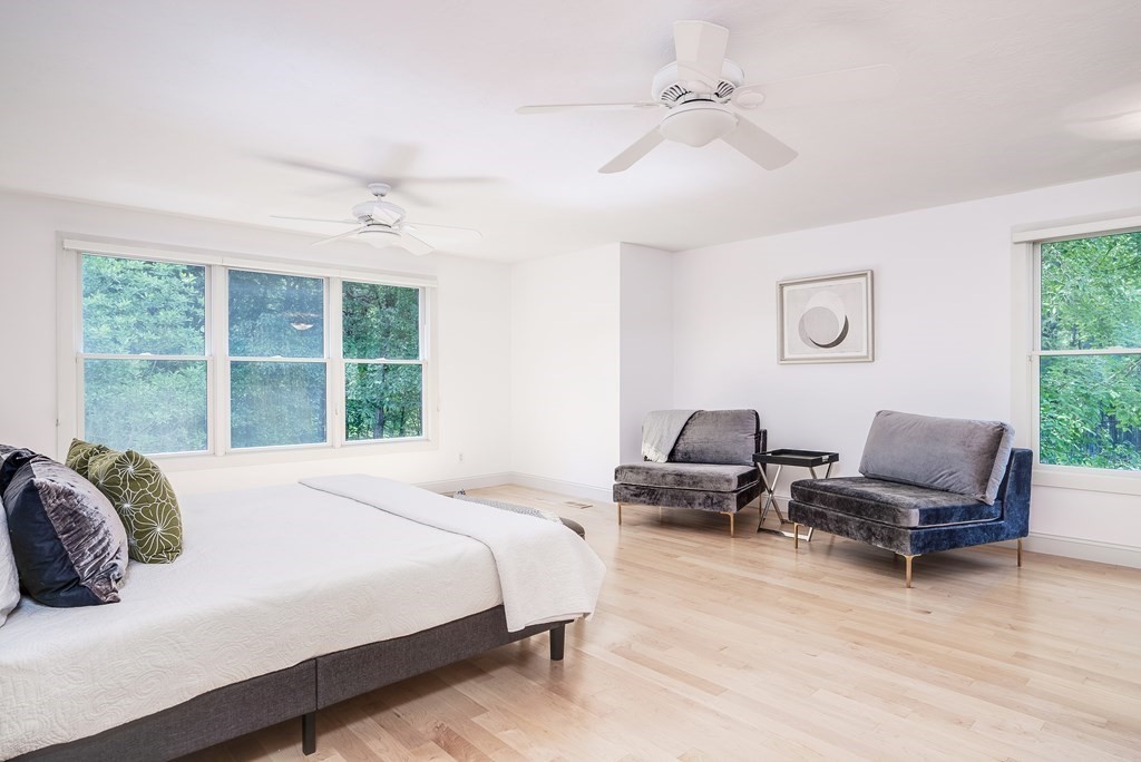 246 Elizabeth Ridge Road Carlisle, MA 01741 - Photo 26 of 38 a spacious bedroom with a bed and large window