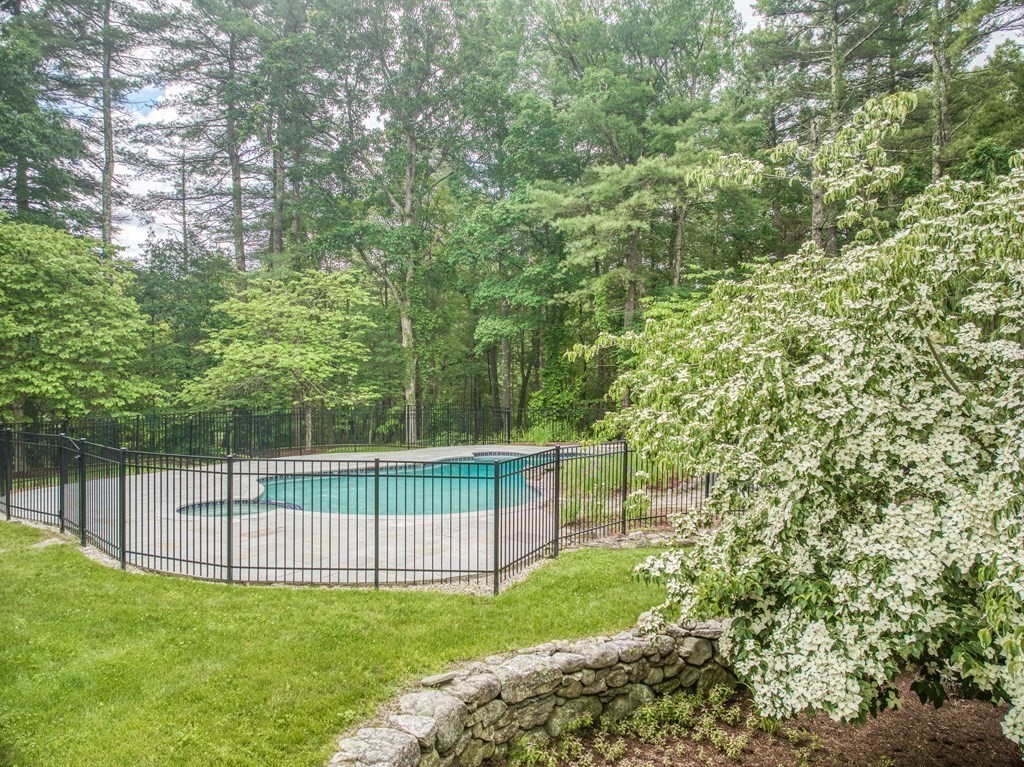246 Elizabeth Ridge Road Carlisle, MA 01741 - Photo 3 of 38 a view of a backyard with a trees