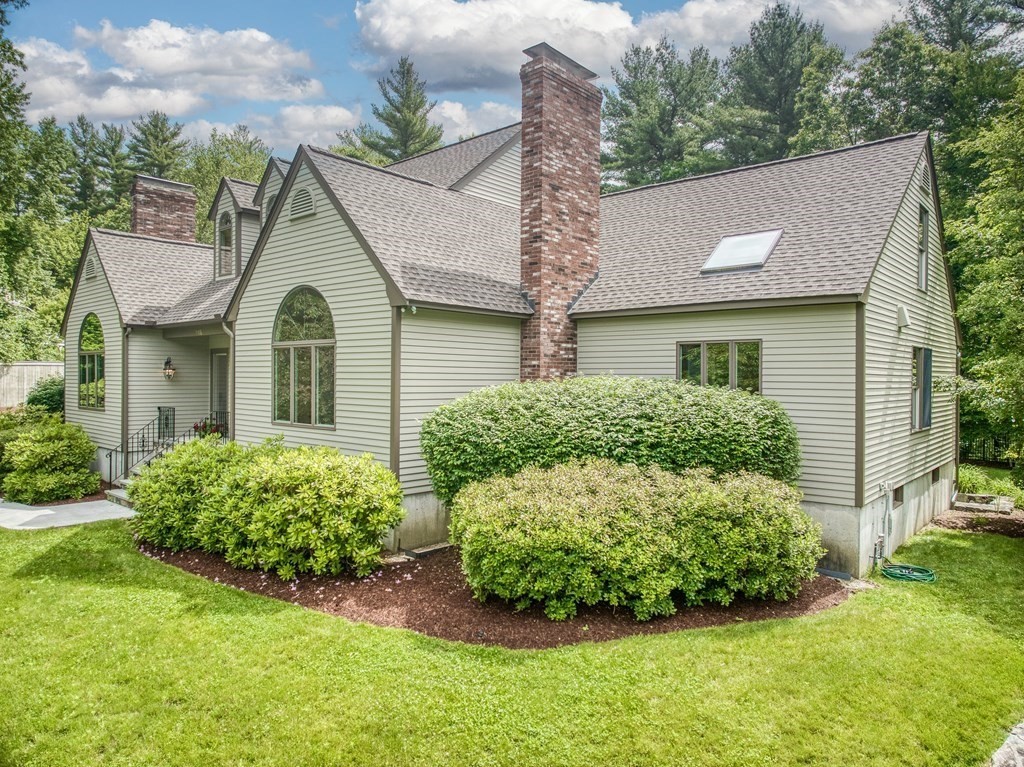 246 Elizabeth Ridge Road Carlisle, MA 01741 - Photo 36 of 38 a view of a house with a garden