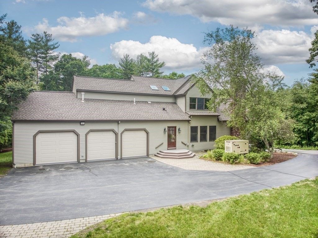 246 Elizabeth Ridge Road Carlisle, MA 01741 - Photo 6 of 38 front view of a house with a yard