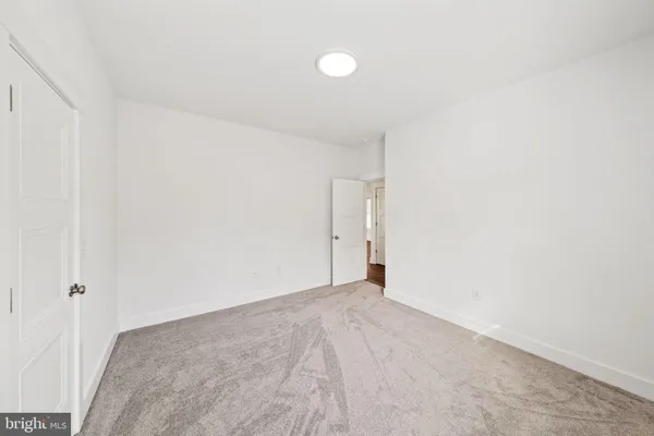 a kitchen with a sink a refrigerator and window