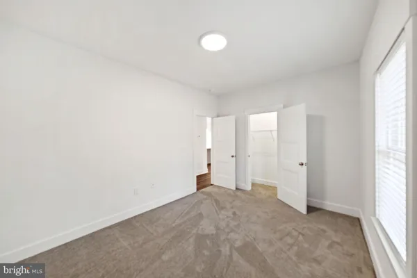 a view of a room with racks on the wall