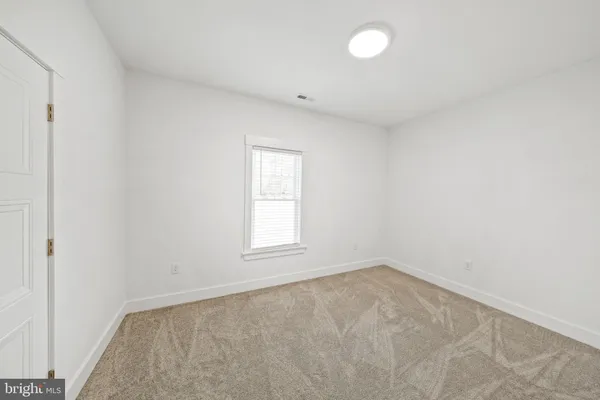 a view of a kitchen with a sink and dishwasher a refrigerator with wooden floor