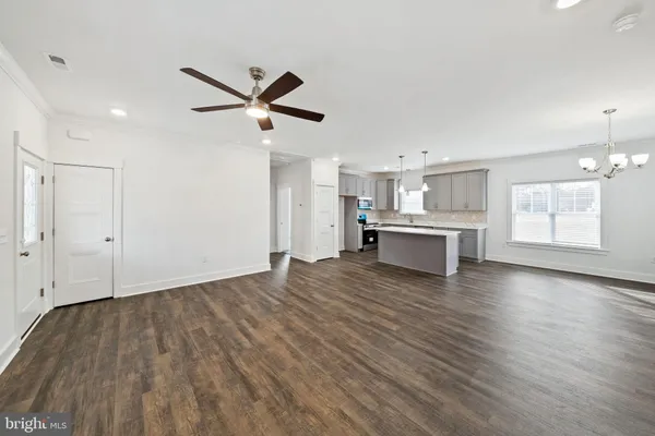 a view of a kitchen with a sink and a window