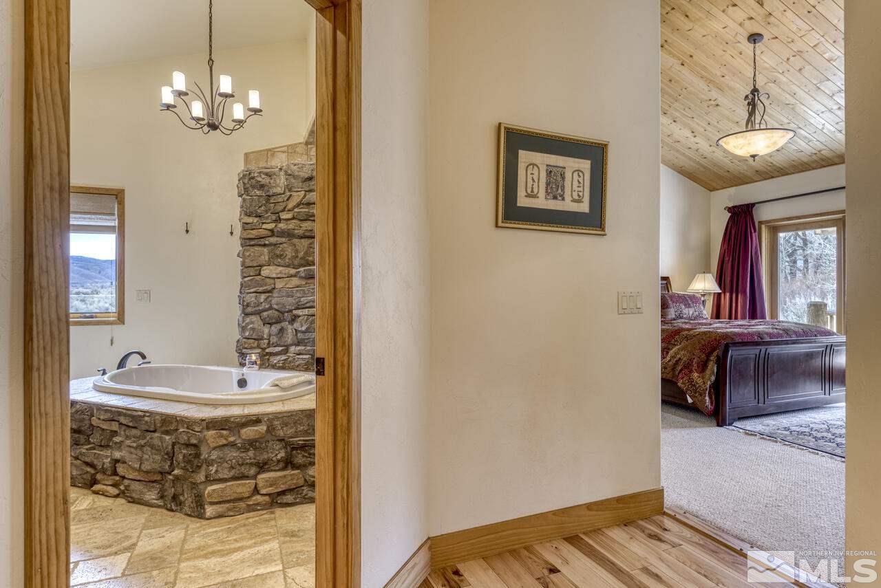 40 Grannie Lane Wellington, NV 89444 - Photo 16 of 40 a en suite bathroom with a sink and a mirror