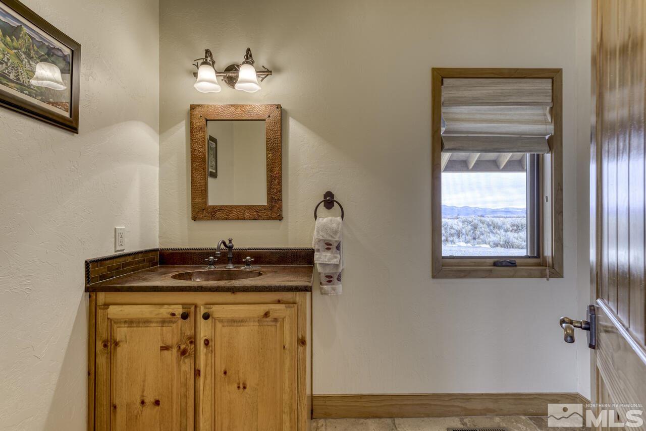 40 Grannie Lane Wellington, NV 89444 - Photo 21 of 40 a bathroom with a sink and a mirror