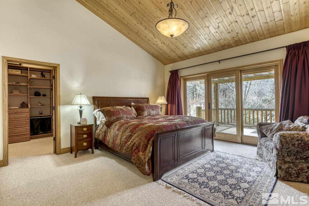 40 Grannie Lane Wellington, NV 89444 - Photo 26 of 40 a bedroom with a large bed and a large window