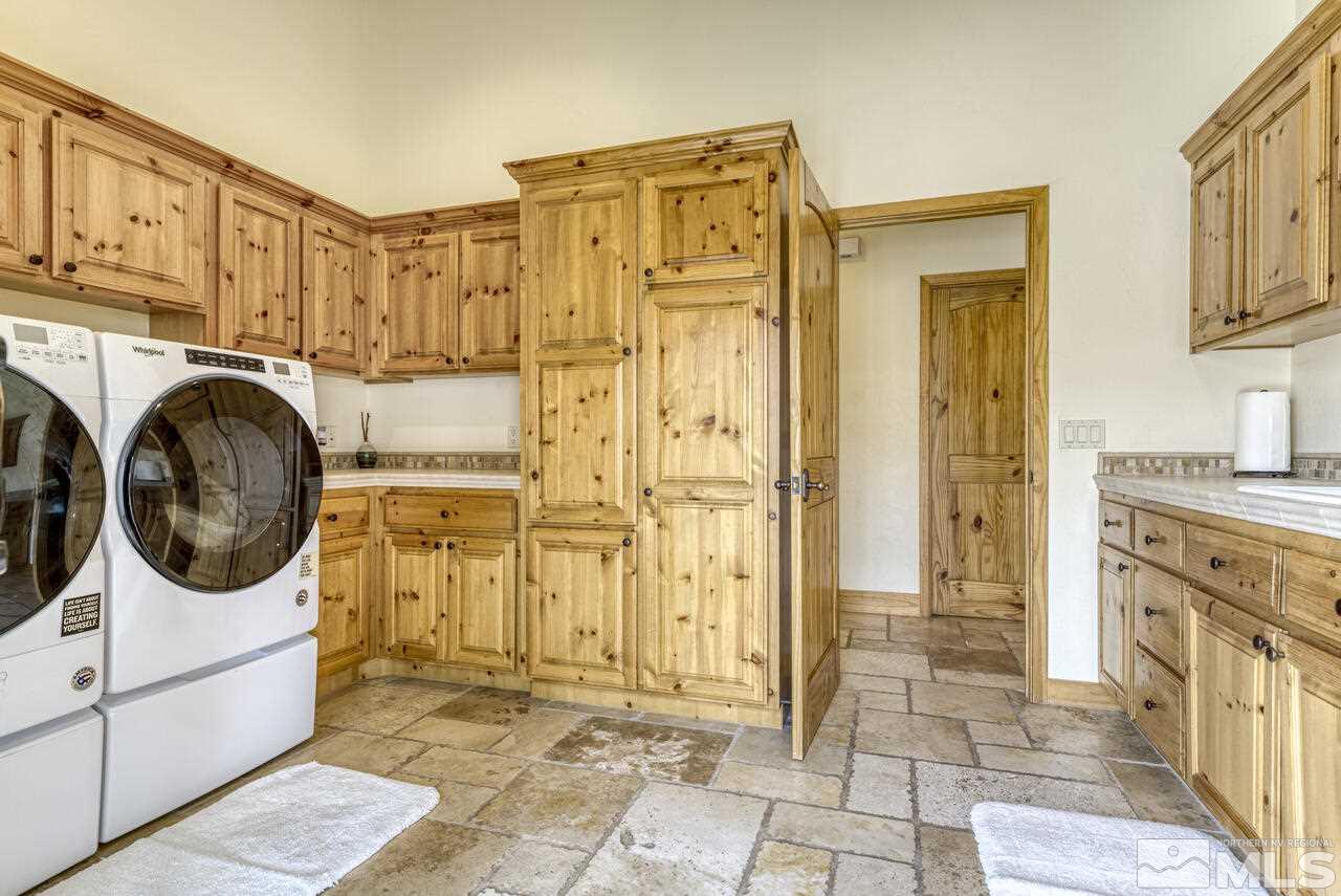 40 Grannie Lane Wellington, NV 89444 - Photo 28 of 40 a bathroom with a sink a washer and dryer