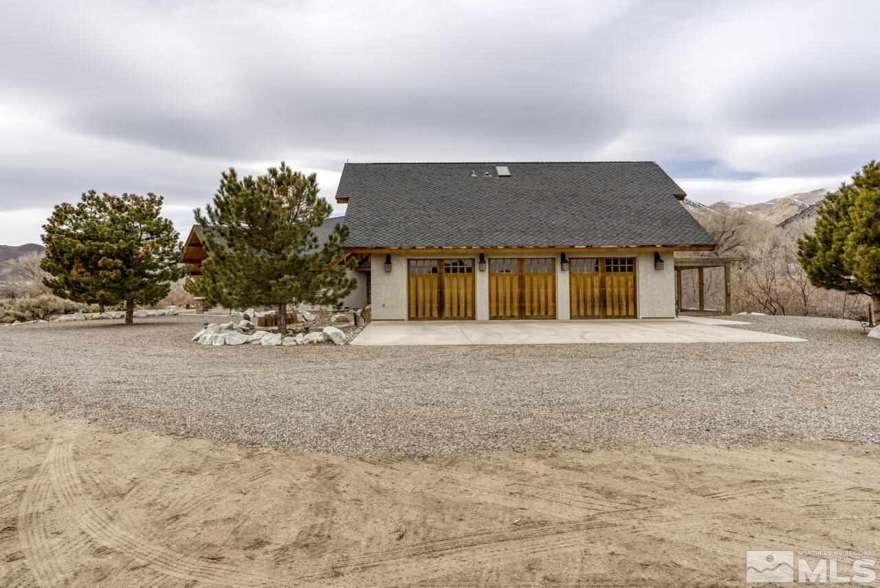 40 Grannie Lane Wellington, NV 89444 - Photo 31 of 40 a front view of a house with a yard and garage