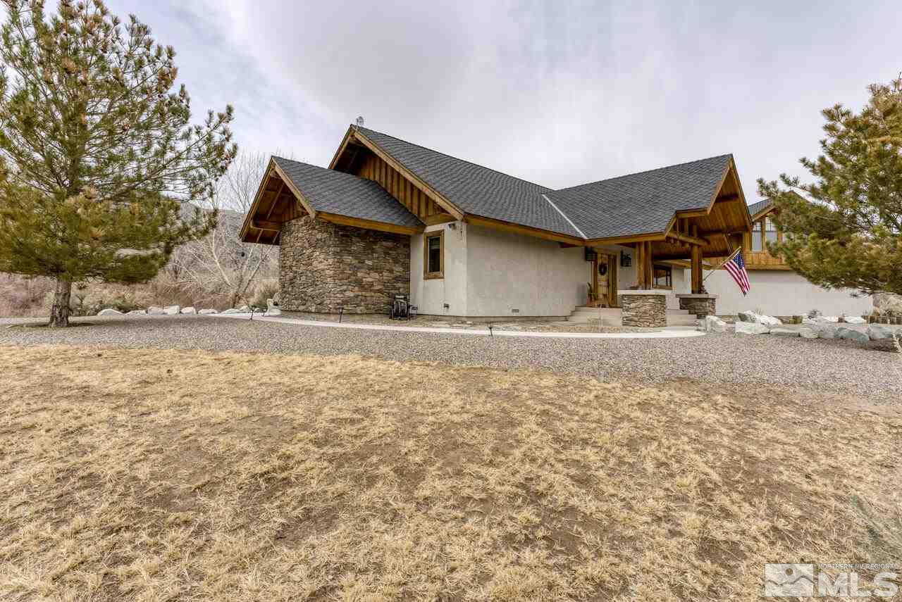 40 Grannie Lane Wellington, NV 89444 - Photo 32 of 40 a front view of a house with a yard