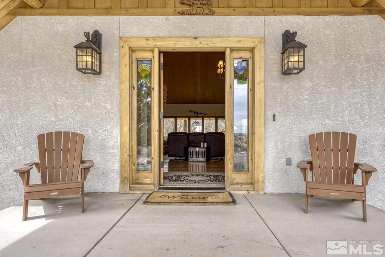 40 Grannie Lane Wellington, NV 89444 - Photo 4 of 40 a view of front door with chair and fire pit