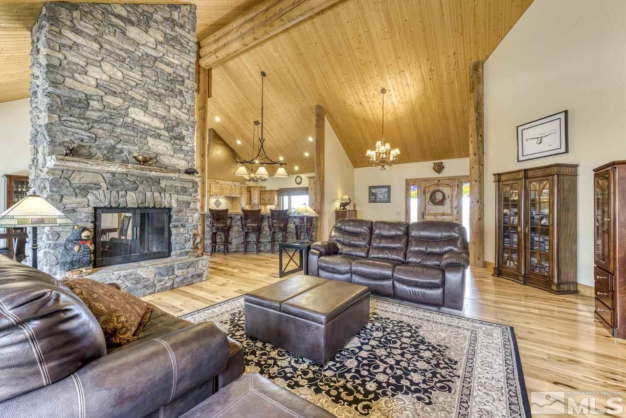 40 Grannie Lane Wellington, NV 89444 - Photo 7 of 40 a living room with furniture and a fireplace