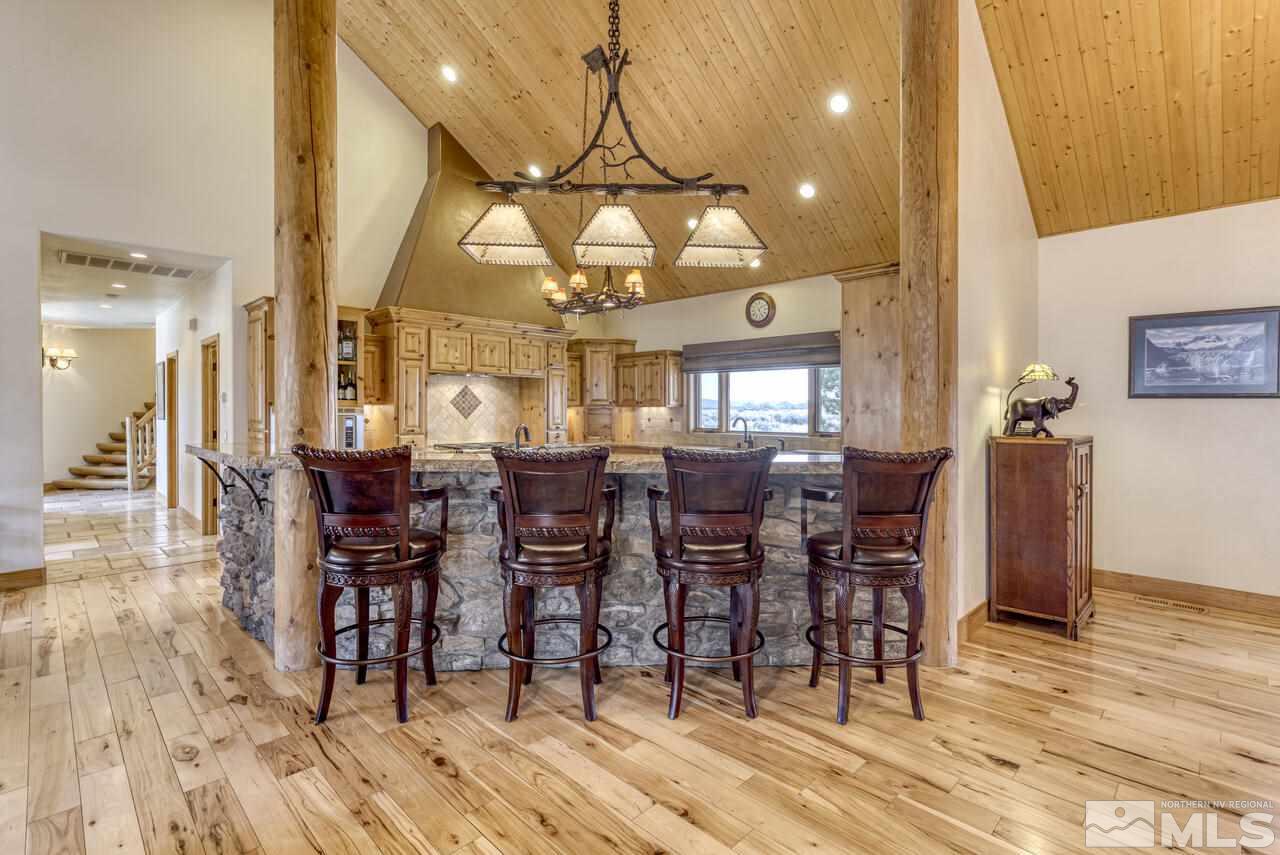 40 Grannie Lane Wellington, NV 89444 - Photo 9 of 40 a view of a dining room with furniture and wooden floor