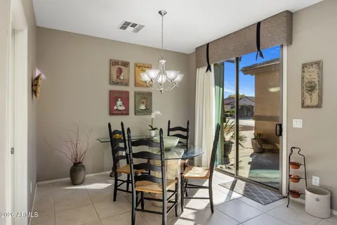a dining room with furniture and window